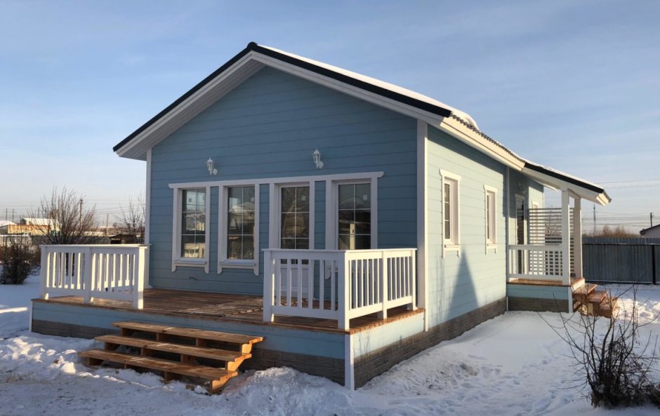 Двухэтажный каркасный дом на сваях