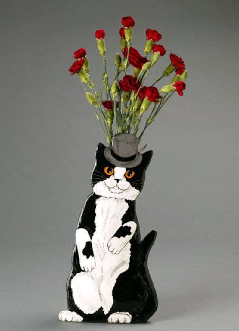 Котенок с вазой